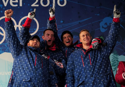 Curt Tomasevicz celebrates with the 2014 Olympics bobsledding team from the U.S.